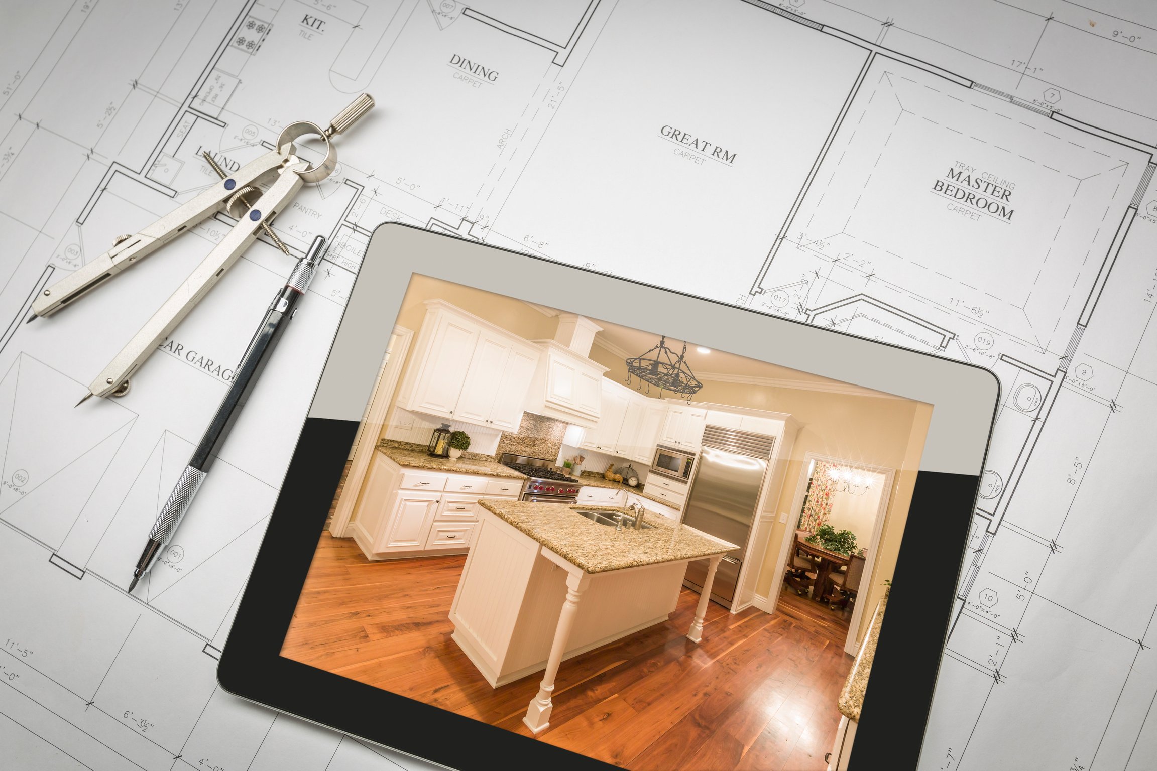 Computer Tablet Showing Finished Kitchen on House Plans, Pencil,